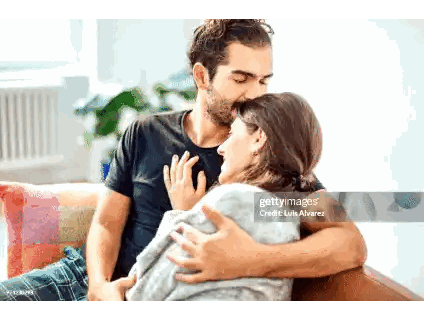 Man Kissing Woman On Couch Sticker