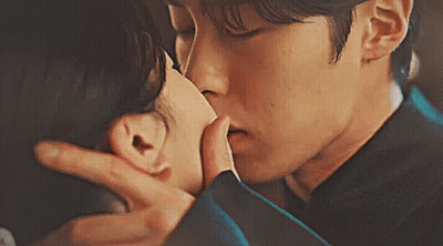 Man Kissing Woman on Forehead