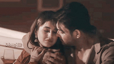 Man Kissing Woman On Forehead Holding Wine GIF
