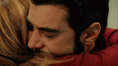 Man Kissing Woman On Forehead While Hugging GIF