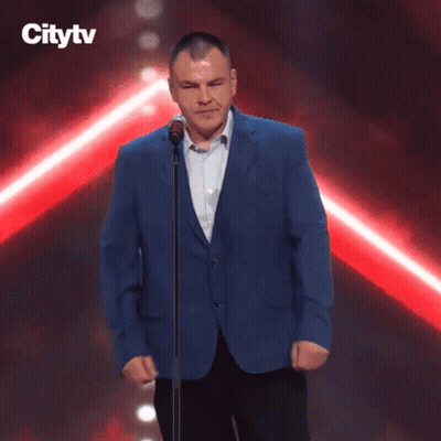 Man Kneeling At Microphone With Citytv Logo GIF
