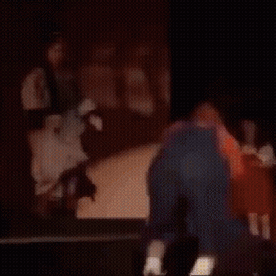 Man Kneeling At Piano With Woman Behind GIF