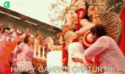 Man Kneeling Before Deity Statue GIF