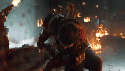 Man Kneeling Before Fire With Sword GIF