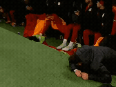 Man Kneeling Before Soccer Players Number 23 GIF