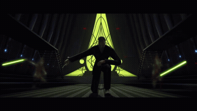 Man Kneeling Before Yellow Triangle GIF