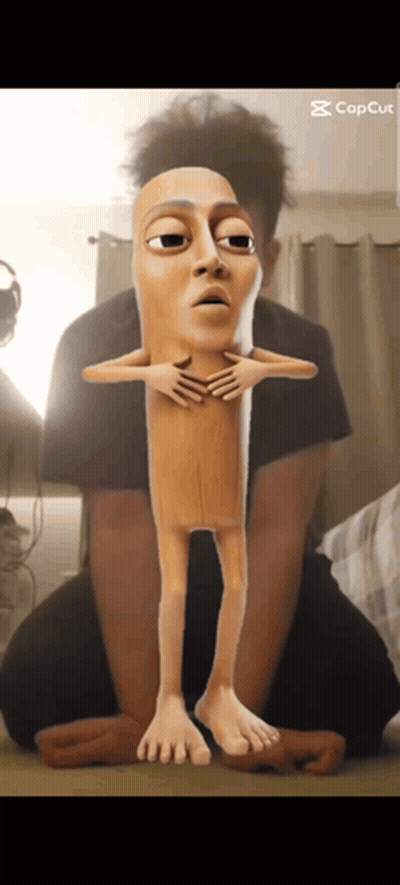 Man Kneeling Beside Cartoon Sausage Stick GIF