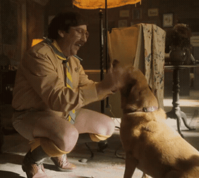Man Kneeling Down With Dog Looking At Him GIF