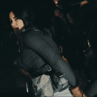 Man Kneeling Holding Gun In Burning Building GIF