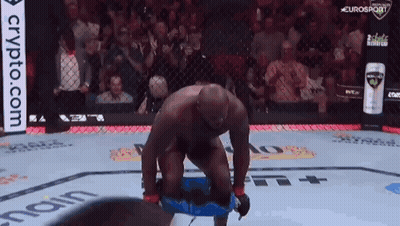 Man Kneeling in Boxing Ring Crypto.com Ad