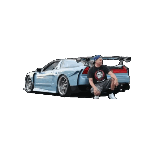 Man Kneeling In Front Of Blue Car With Skull Shirt Sticker