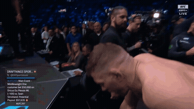 Man Kneeling In Front Of DraftKings Screen GIF