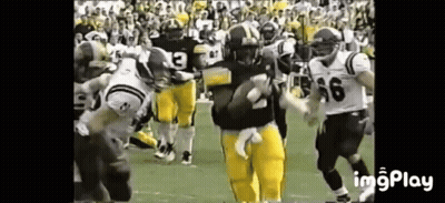 Man Kneeling In Front Of Large Fire GIF