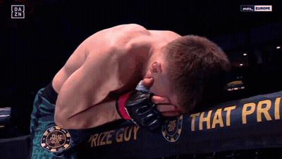 Man Kneeling In Front Of Prize Guy Sign GIF