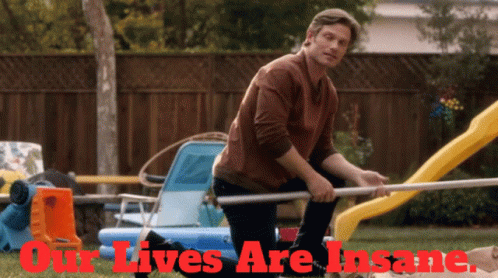 Man Kneeling In Front Of Slide With Our Lives Are Insane GIF