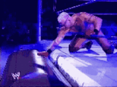 Man Kneeling In Wrestling Ring GIF