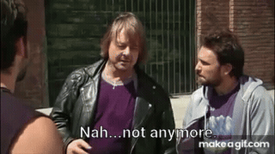 Man Kneeling Next To Another Man In Blue Jeans GIF