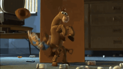 Man Kneeling Next To Buzz Lightyear And Woody GIF