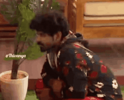 Man Kneeling Next To Potted Plant GIF