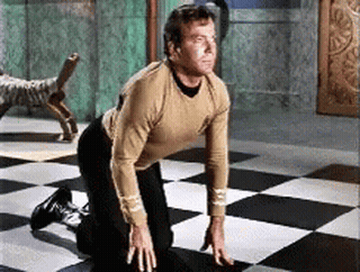 Man Kneeling On Checkered Floor GIF