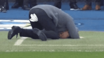 Man Kneeling On Football Field GIF