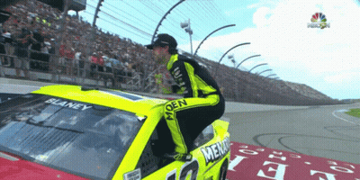 Man Kneeling On Hood Of Race Car Saying Blaney GIF