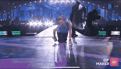 Man Kneeling On Stage With GIF Maker App GIF