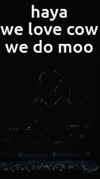 Man Kneeling On Stage With Moo Words GIF