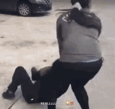 Man Kneeling While Another Man Holds Him GIF
