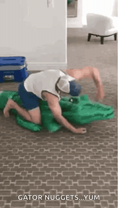 Man Kneeling With Crocodile Costume GIF