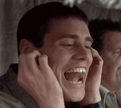 Man Laughing Covering Ears In Mirror GIF