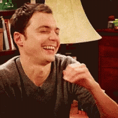 Man Laughing Eyes Closed By Lamp GIF