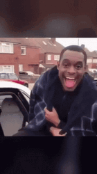 Man Laughing Getting Inside The Car GIF