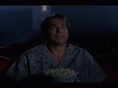 Man Laughing Holding Bowl Of Popcorn GIF