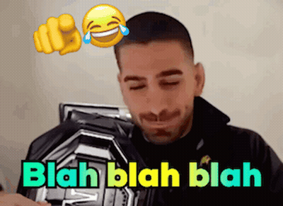 Man Laughing Holding Plaque Saying Blah GIF