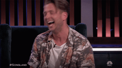 Man Laughing In Chair On NBC GIF