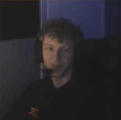 Man Laughing In Dark Room With Headphones GIF