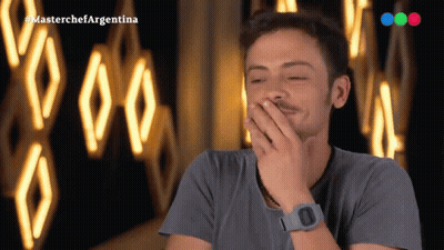 Man Laughing In Front Of MasterChef Argentina Logo GIF