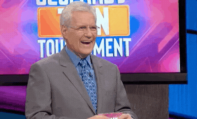 Man Laughing In Front Of Tournament Sign GIF