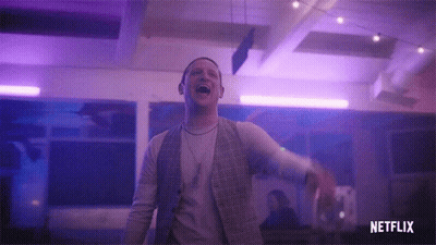 Man Laughing In Purple Lit Room With Netflix Logo GIF