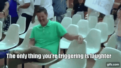 Man Laughing In Row Of Chairs GIF