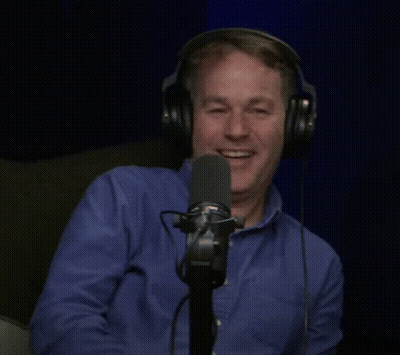 Man Laughing Into Microphone With Headphones GIF