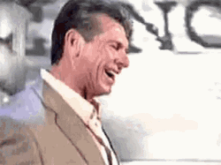Man Laughing Vince Mc Mahon On Stage GIF