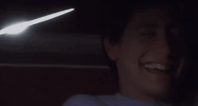 Man Laughing With Light Coming Out Of Mouth GIF