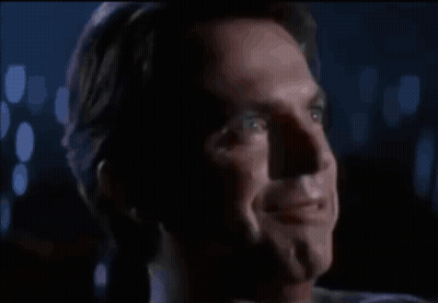 Man Laughing With Mouth Open In Dark GIF