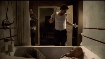 Man Laying In Bathtub Holding Knife GIF