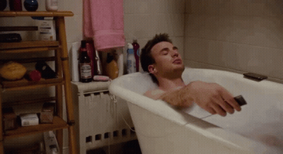 Man Laying In Bathtub With Budweiser GIF