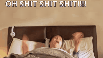 Man Laying In Bed With Headphones Saying Oh Shit GIF