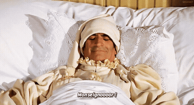 Man Laying In Bed With Word Monseigneur GIF