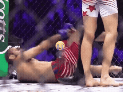Man Laying In Boxing Ring With Smiley Face GIF